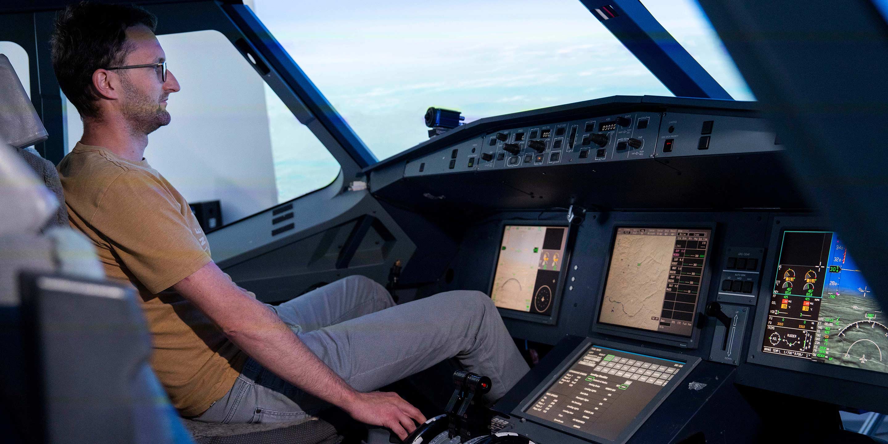 an image of a man seated in a plane cockpit with Honeywell technology monitoring for pilot drowsiness